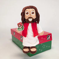 The Shoebox Jesus Doll sits on an Operation Christmas Child shoebox.  A perfect WOW gift for shoebox donations.
