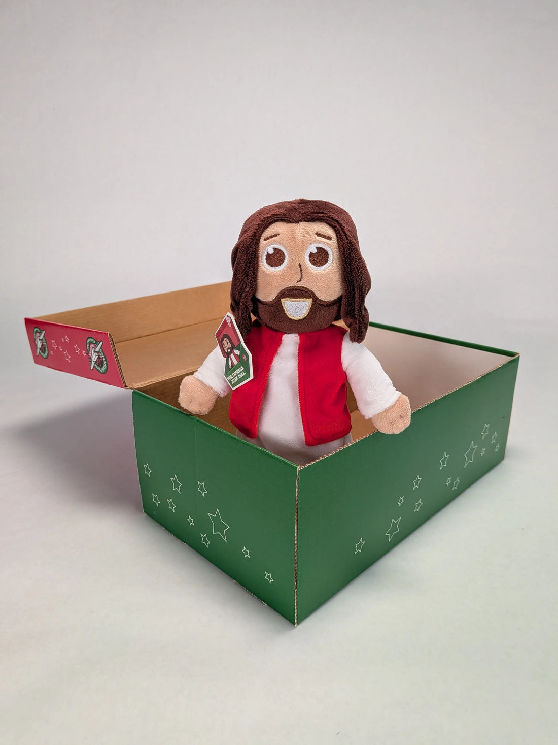 The Shoebox Jesus Doll from Jesusdoll.com sits in an Operation Christmas Child shoebox.