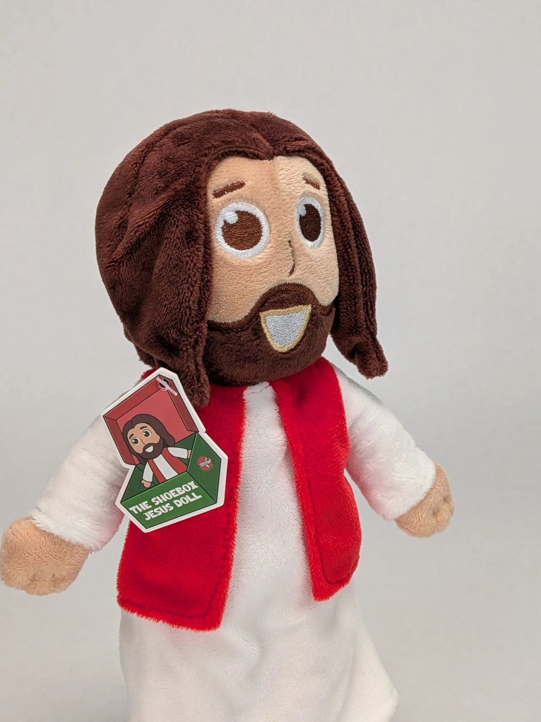 The Shoebox Jesus Doll from Jesusdoll.com.  Side view with new tag (2026) visible. 
